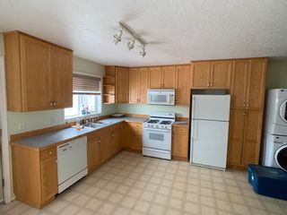 Photo 27: 15 TAZMA Crescent in Fort Nelson: Fort Nelson -Town House for sale : MLS®# R2680771