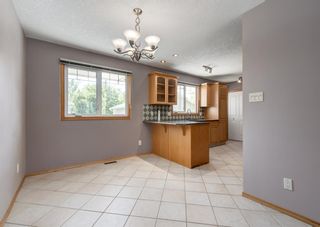 Photo 6: 128 Queensland Place SE in Calgary: Queensland Detached for sale : MLS®# A1224303