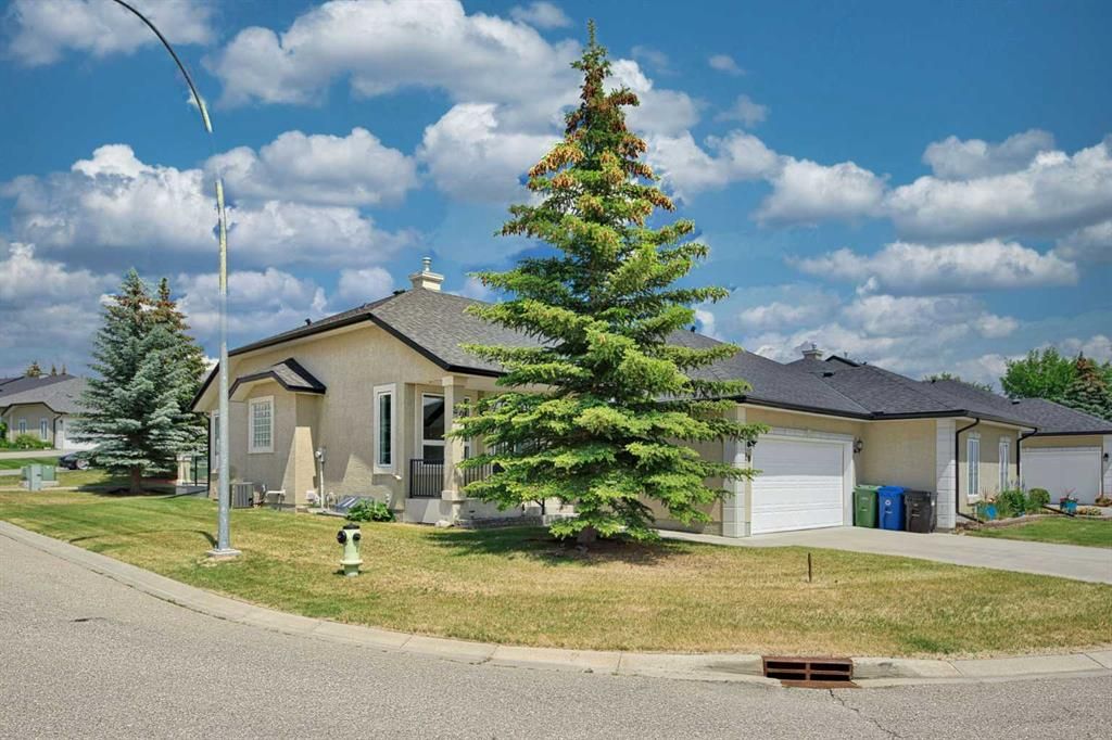 Main Photo: 20 Tuscany Village Court NW in Calgary: Tuscany Semi Detached (Half Duplex) for sale : MLS®# A2059130