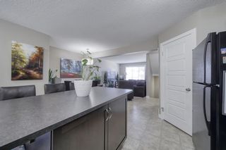 Photo 5: 555 Panatella Boulevard NW in Calgary: Panorama Hills Row/Townhouse for sale : MLS®# A2034434