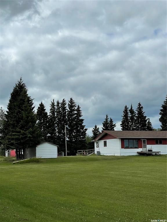 Mature yard with house, 2 garages, shed, new dugout and propane furnace and hot water heater