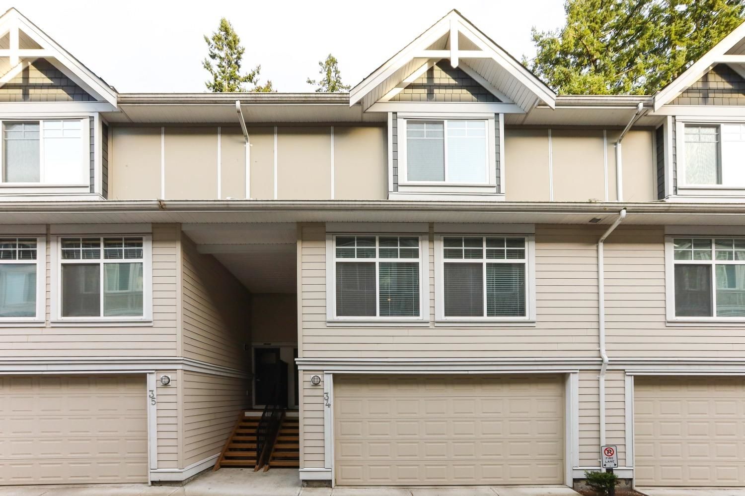 Main Photo: 34 12775 63 Avenue in Surrey: Panorama Ridge Townhouse for sale in "The Enclave" : MLS®# R2657294