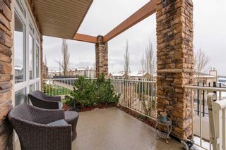 Photo 2: 4 124 Rockyledge View NW in Calgary: Rocky Ridge Apartment for sale : MLS®# A2128252