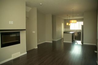 Photo 5: 668 Copperpond Boulevard SE in Calgary: Copperfield Row/Townhouse for sale : MLS®# A1242943
