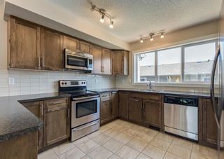 Photo 10: 59 Fireside Parkway: Cochrane Row/Townhouse for sale : MLS®# A2053037