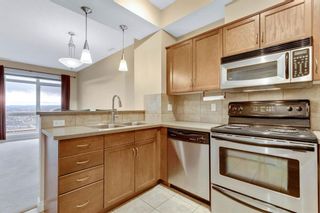 Photo 2: 14 169 Rockyledge View NW in Calgary: Rocky Ridge Row/Townhouse for sale : MLS®# A1159449