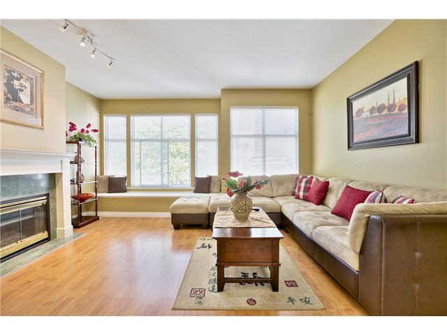 "Beautiful elegant and generous living room with updated floors and paint. Large windows allow lots of natural light facing the playground