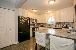 Photo 6: 404 2733 ATLIN Place in Coquitlam: Coquitlam East Condo for sale in "ATLIN COURT" : MLS®# R2232992