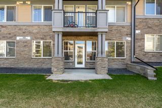 Photo 1: 107 10 Panatella Road NW in Calgary: Panorama Hills Apartment for sale : MLS®# A1199895