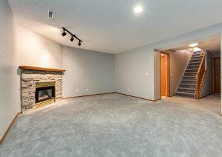 Photo 21: 20 Arbour Cliff Close NW in Calgary: Arbour Lake Semi Detached for sale : MLS®# A1216259