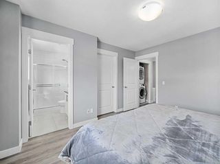 Photo 24: 7 West Coach Manor SW in Calgary: West Springs Row/Townhouse for sale : MLS®# A2129977