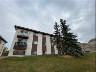 Photo 1: 411 - 11TH Ave (Quadra) in Drumheller: Multifamily for sale