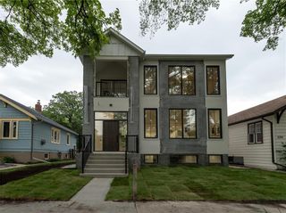 Photo 1: 318 Beaverbrook Street in Winnipeg: River Heights North Residential for sale (1C)  : MLS®# 202327410
