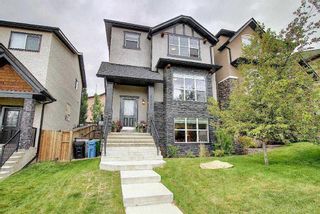 Main Photo: 9058 14 Avenue SW in Calgary: Aspen Woods Semi Detached (Half Duplex) for sale : MLS®# A2122006