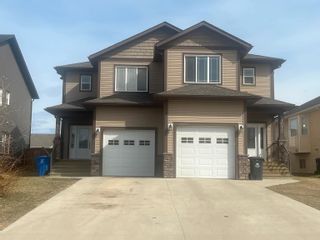 Photo 1: 11012 104A Avenue in Fort St. John: Fort St. John - City NW 1/2 Duplex for sale : MLS®# R2750586