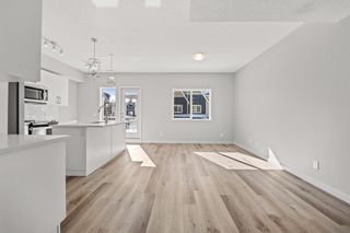 Photo 4: 806 32 Red Embers Parade NE in Calgary: Redstone Row/Townhouse for sale : MLS®# A2032219