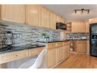 Photo 15: 69 STRATHLEA Place SW in Calgary: Strathcona Park House for sale : MLS®# C4101174