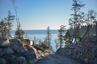 Photo 1: 7643 COVE BEACH Road in Halfmoon Bay: Halfmn Bay Secret Cv Redroofs Land for sale in "Cove Beach" (Sunshine Coast)  : MLS®# R2758910