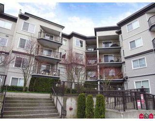 Photo 1: 106 5765 GLOVER Road in Langley: Langley City Condo for sale in "College Court" : MLS®# F2712182