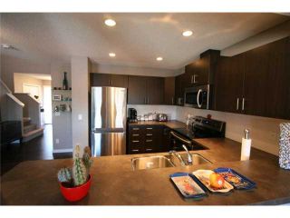 Photo 5: 225 SUNSET Common: Cochrane Residential Attached for sale : MLS®# C3590396