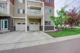 Photo 2: 405 Redstone View NE in Calgary: Redstone Row/Townhouse for sale : MLS®# A1224923