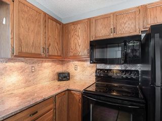 Photo 6: 12 140 STRATHAVEN Circle SW in Calgary: Strathcona Park Semi Detached for sale : MLS®# C4229318