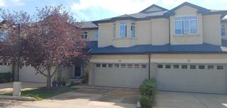 Photo 1: 39 Wentworth Cove SW in Calgary: West Springs Row/Townhouse for sale : MLS®# A2078163