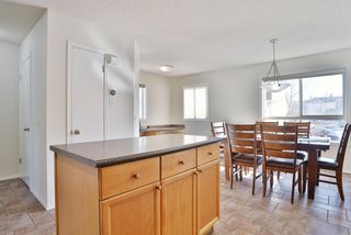Photo 13: 85 Tuscany Court NW in Calgary: Tuscany Row/Townhouse for sale : MLS®# A2033070