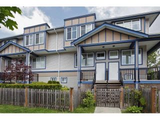 Photo 1: 60 13899 LAUREL Drive in Surrey: Whalley Townhouse for sale in "EMERALD GREEN" (North Surrey)  : MLS®# F1441178