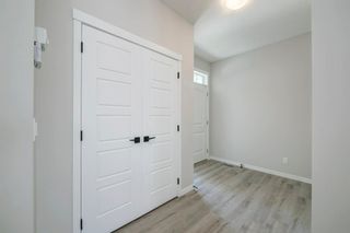 Photo 4: 89 Creekside Way SW in Calgary: C-168 Detached for sale : MLS®# A1013282