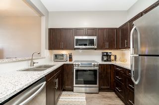 Photo 5: 108 2340 HAWTHORNE Avenue in Port Coquitlam: Central Pt Coquitlam Condo for sale in "BARRINGTON PLACE" : MLS®# R2772699