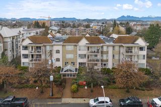Photo 1: 104 20257 54 Avenue in Langley: Langley City Condo for sale in "Oxford Court" : MLS®# R2845170