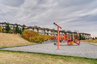 Photo 32: 9 133 Rockyledge View NW in Calgary: Rocky Ridge Row/Townhouse for sale : MLS®# A2002655