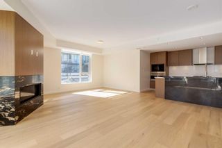 Photo 10: 102 88 Waterfront Mews SW in Calgary: Chinatown Apartment for sale : MLS®# A2116284