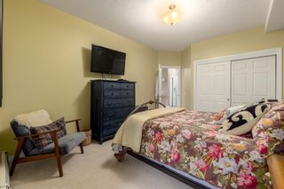 Photo 25: 210 248 Sunterra Ridge Place: Cochrane Apartment for sale : MLS®# A2053195