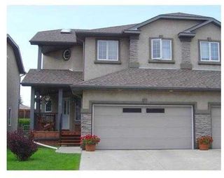 Photo 1: 8 Prominence Park SW in Calgary: Patterson Semi Detached (Half Duplex) for sale : MLS®# A2126879