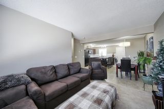 Photo 9: 555 Panatella Boulevard NW in Calgary: Panorama Hills Row/Townhouse for sale : MLS®# A2034434