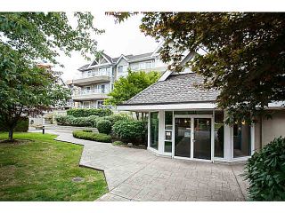 Photo 1: 201 5556 201A Street in Langley: Langley City Condo for sale in "Michaud Gardens" : MLS®# F1421361