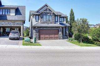 Photo 1: 9302 14 Avenue SW in Calgary: Aspen Woods Detached for sale : MLS®# A2024836