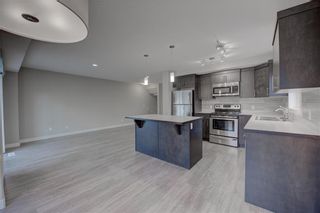 Photo 12: 405 Redstone View NE in Calgary: Redstone Row/Townhouse for sale : MLS®# A1224923