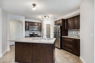 Photo 6: 104 120 Panatella Landing NW in Calgary: Panorama Hills Row/Townhouse for sale : MLS®# A2051554
