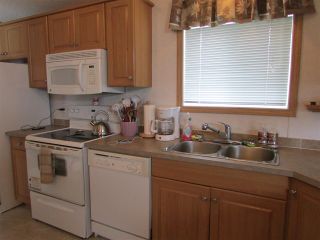 Photo 3: 49 9203 82 Street in Fort St. John: Fort St. John - City SE Manufactured Home for sale in "THE COURTYARD" (Fort St. John (Zone 60))  : MLS®# R2074488