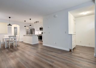 Photo 9: 26 Mike Ralph Way SW in Calgary: Garrison Green Row/Townhouse for sale : MLS®# A2047049