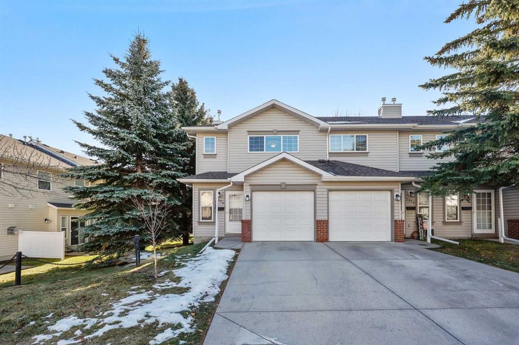 Main Photo: 1308 154 Avenue SW in Calgary: Millrise Row/Townhouse for sale : MLS®# A2092204