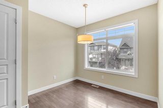 Photo 12: 125 Panatella Road NW in Calgary: Panorama Hills Row/Townhouse for sale : MLS®# A2074246