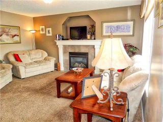Photo 10: 1010 BRIDLEMEADOWS Manor SW in Calgary: Bridlewood House for sale : MLS®# C4065914