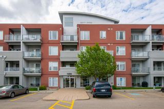 Photo 2: 1415 604 East Lake Boulevard NE: Airdrie Apartment for sale : MLS®# A1229561