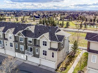 Photo 1: 123 Toscana Gardens NW in Calgary: Tuscany Row/Townhouse for sale : MLS®# A1217393