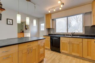Photo 15: 322 Woodvale Crescent SW in Calgary: Woodlands Row/Townhouse for sale : MLS®# A2015272
