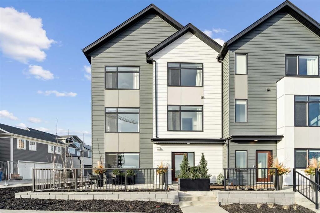 Main Photo: 111 Dieppe Link SW in Calgary: Currie Barracks Row/Townhouse for sale : MLS®# A2106629